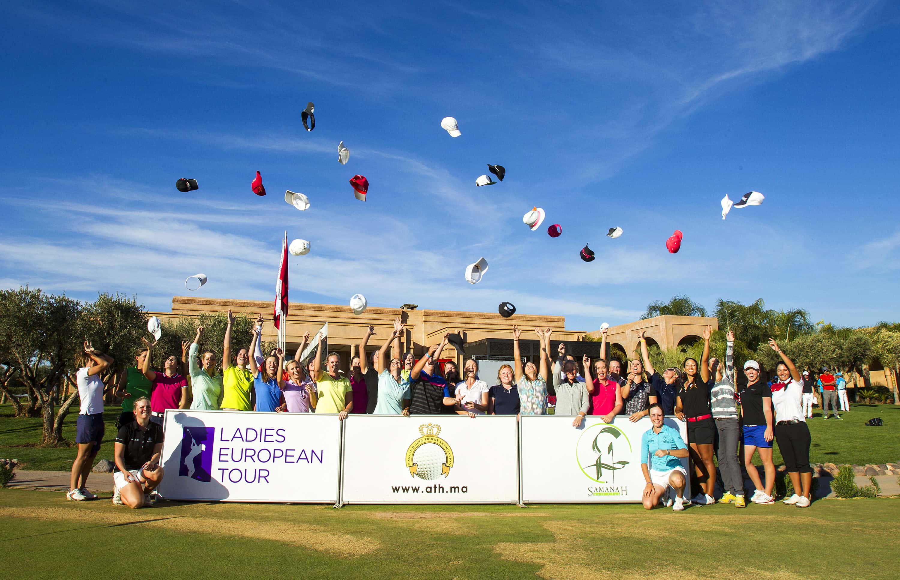 Playesr throw their caps into the air in celelbration of gaining their Ladies European Tour cards for the 2015 season